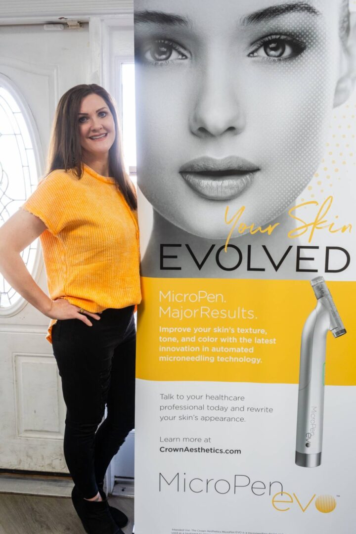 A woman standing next to a sign that says " you have evolved ".